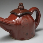 Teapot with rays on spout