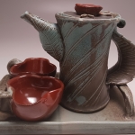 Side View of Teapot and Cups on Tray